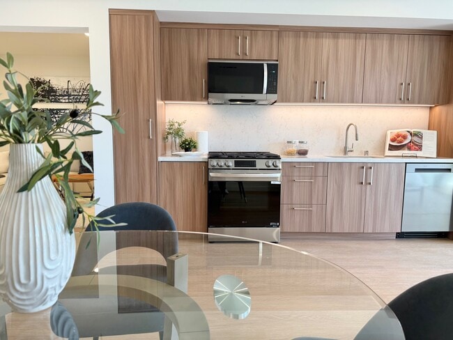 Building Photo - 8900 Ramsgate Ave Unit 206