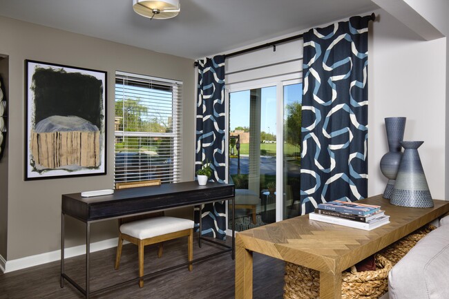 Sunroom with work space - The Willows of Plainview