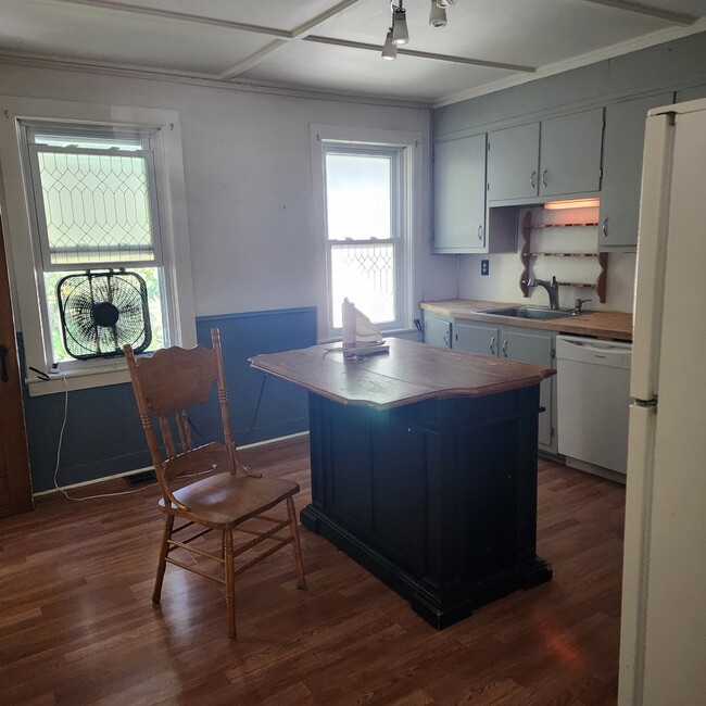Kitchen with dishwasher and gas range