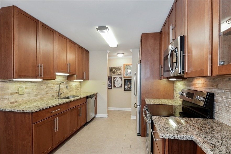 Spacious  kitchen with Cherry Cabinets, Granite Countertops and Stainless Steel Appliances