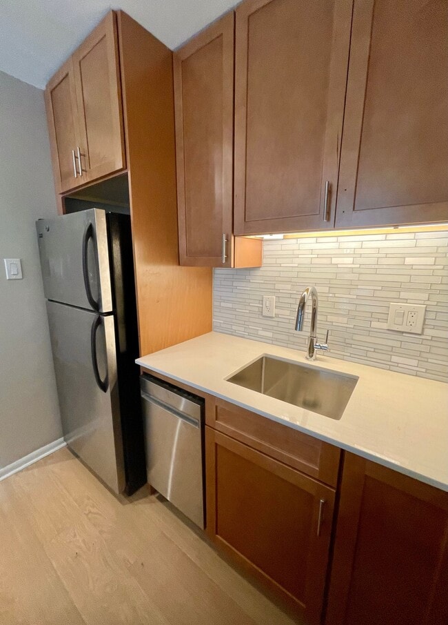 Granite countertops and glass tile backsplash - 1260 21st St NW Unit Newport Apartment