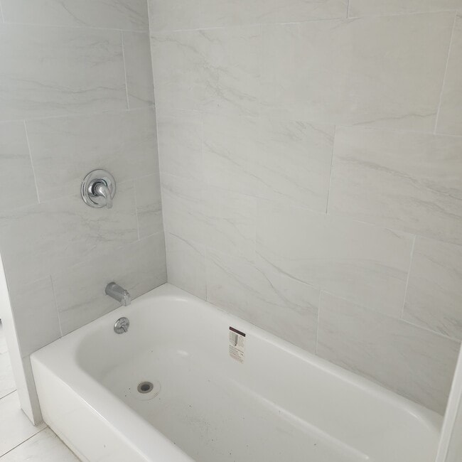 New tub and all new tile. - 347 Park Ave