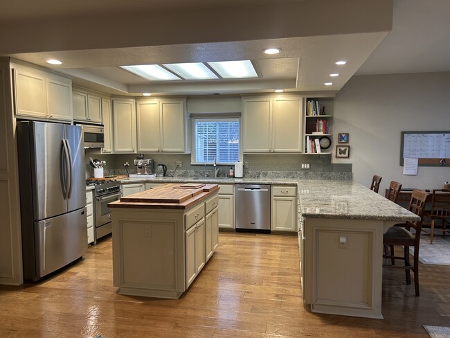 Updated and open kitchen area with bar for eating - 1830 Glenn Pl House