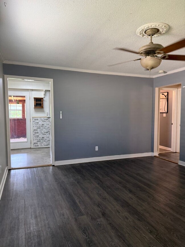 Photo - Charming 2-Bedroom Home with an Enclosed Sunroom & Peaceful Outdoor Living