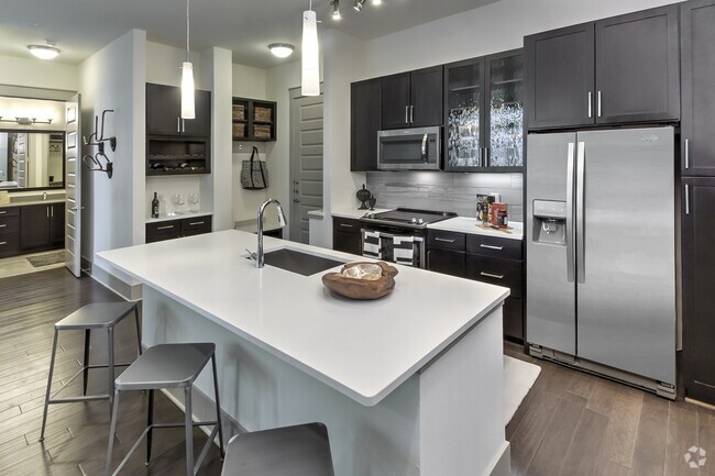 Expansive kitchen island in select homes. - Windsor Fitzhugh Rental