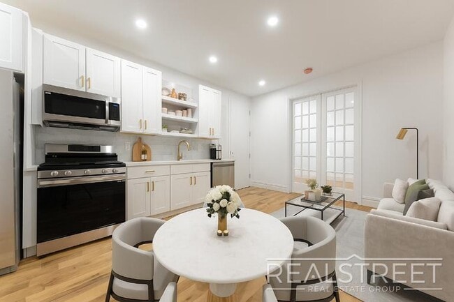 Photo - STUNNING 4+ BED 3 BATH DUPLEX + YARD IN PRIME BUSHWICK TOWNHOUSE Unit 1