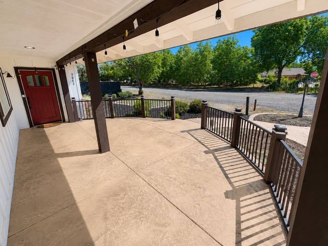 Photo - Private 3BR Home on Approx. 1 Acre | Huge Fenced Yard, Sunroom & 2-Car Garage
