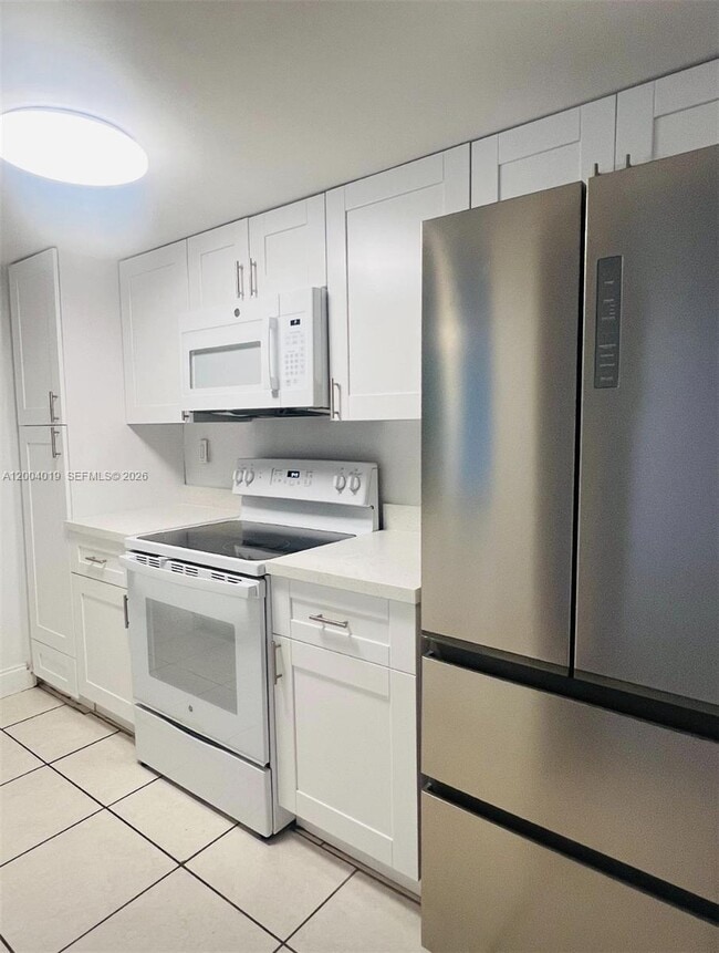 Building Photo - 7075 NW 186th St Unit C205