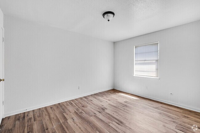 3BR, 1BA - 650SF - Primary Bedroom - Move-In Special | Affordable Angleton Apts