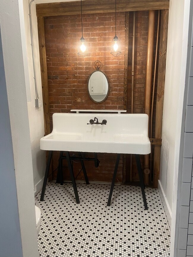 Restored cast iron bathroom sink - 616 W Azeele St Unit #1