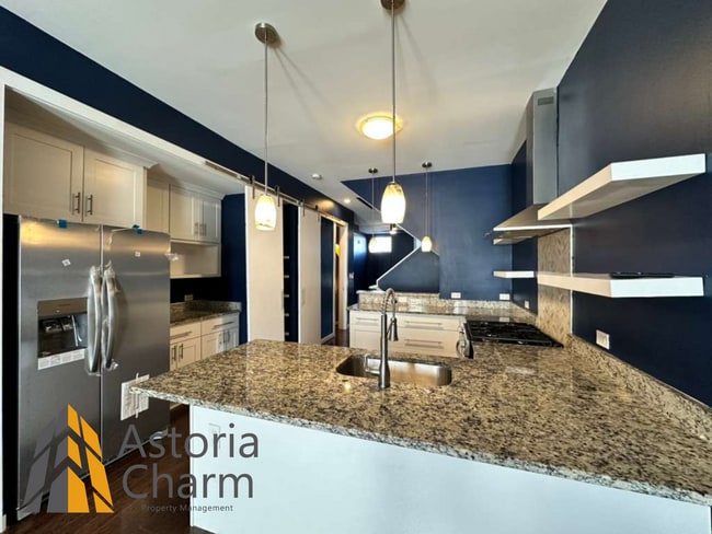 Building Photo - Beautifully Renovated 3BR Rowhome Near Johns Hopkins – Gated Parking + Modern Upgrades