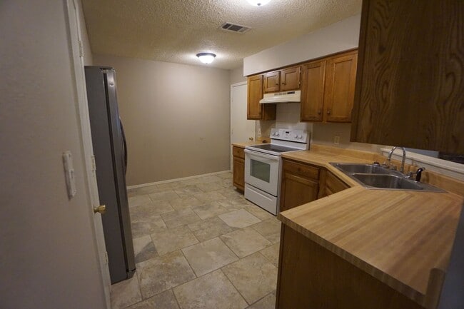 Photo - 3 Bed 2 Bath 1 Car Garage with Yard Care Included, Refrigerator Provided.