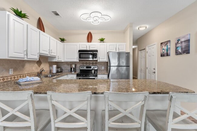 Photo - Beautifully furnished 2B/2B condo steps from Gulf of Mexico available for long term lease!