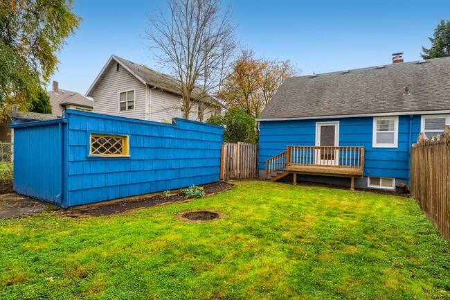 Pets love the 1600 sqft yard & tons of storage in your private garage - 451 NE Sumner St