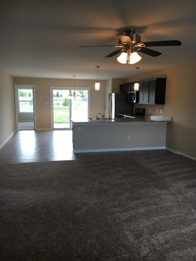 View from Front Door into Great Room, Kitchen and outdoor Patio - 8590 Jackson St