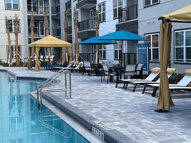 Experience relaxation at our upscale poolside haven, perfect for sunny days. - The Juliette