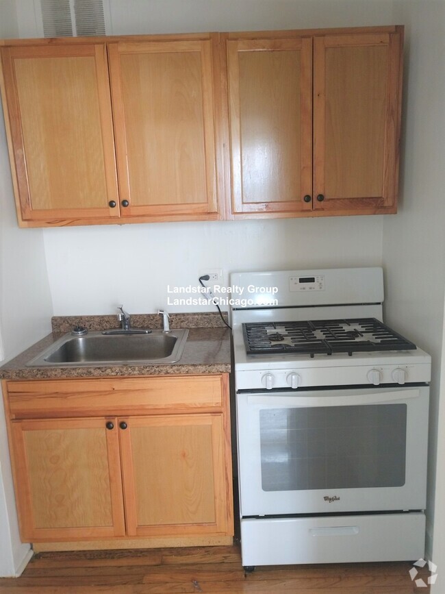 Building Photo - 1369 W Estes Ave Unit 2I Rental