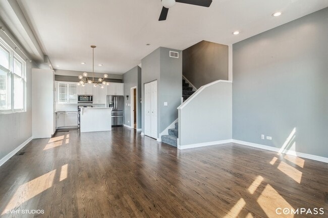 Natural light dances through the space, creating a warm and inviting ambiance. - 916 N Elizabeth St