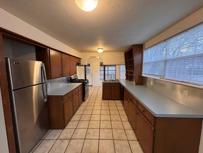 Photo - Cozy with lots of character, flexible floor plan could be 4-or 5-bedroom, oversized garage and la...