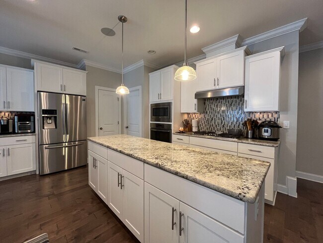 Photo - Exceptional 4BD, 2.5BA Cary Townhome with 2-Car Garage, Bonus 2nd Floor Living Space, and Private...