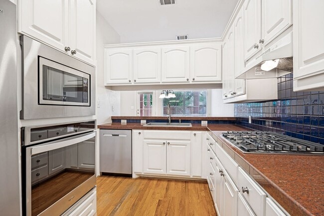 Photo - Sophisticated Addison Townhome with Vaulted Ceilings, Study & Two Primary Suites!