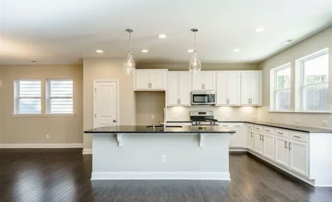 Photo - Beautiful & Open 4 Bedroom + 2.5 bath home with Loft!