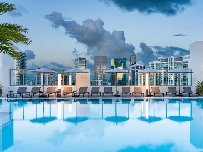 Take in breathtaking Miami skyline views from Modera Riverside’s rooftop pool deck. - Modera Riverside