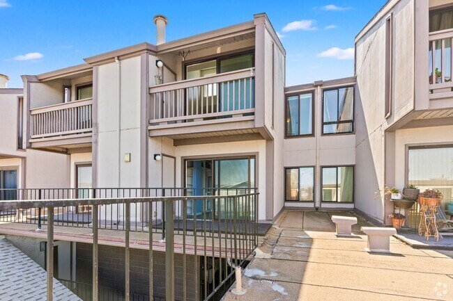 Building Photo - Shoreline Serenity: Modern Condo Steps fro...