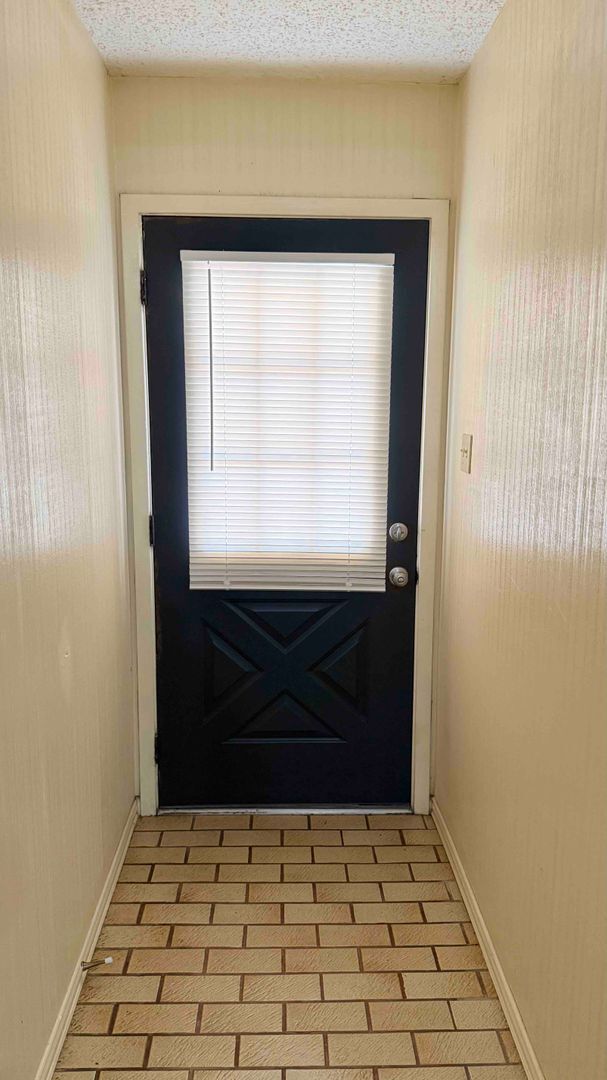 Photo - 3 bedroom / 2 bath / 2 car garage - Covered porch with shaded back yard