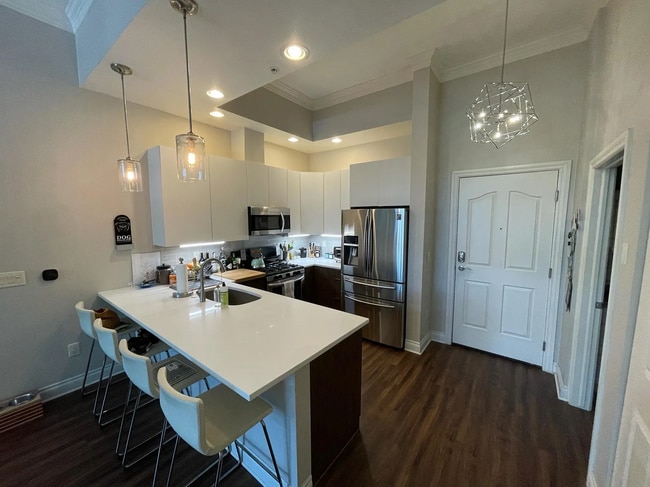 Unit entrance, LED and Edison Bulb fixtures - 1700 N Emerson St