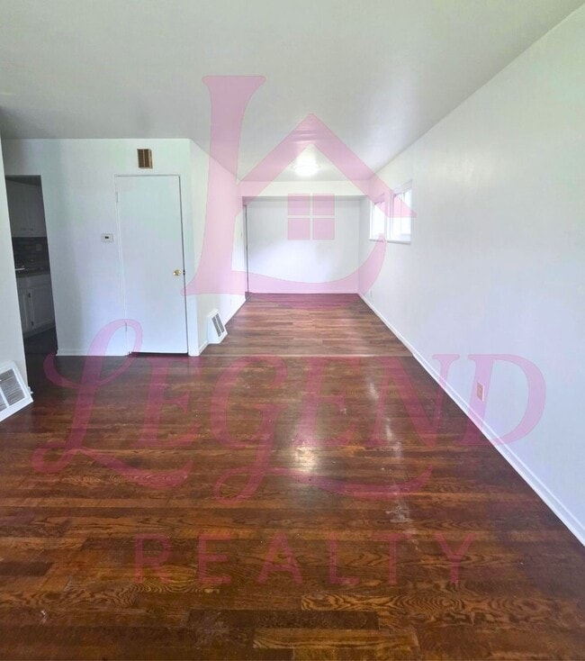 Photo - 3 Bedrooms | 1 Bathroom | Hardwood Floors | Bright Living/Dining Area | Galley Kitchen | Unfinish...