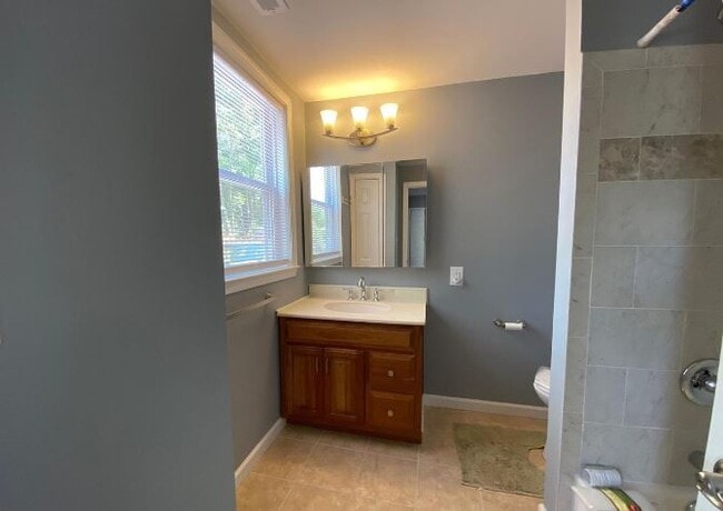 Notice the nicely tiled bath/shower - 26 W Center St Unit A