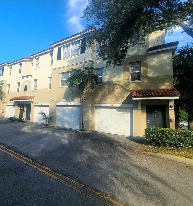 Building Photo - 5840 W Sample Rd Unit 202