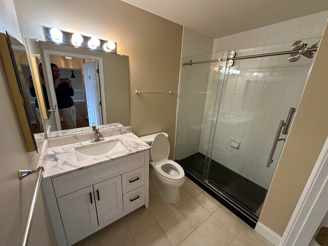 Guest/2nd bathroom…new walk in shower, vanity and toilet - 11776 Stratford House Pl Unit 1004