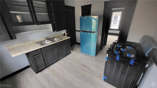 Building Photo - 10012 Parkgate Ave Unit Upper Rental