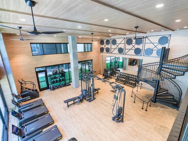 Elevate your wellness routine in our expansive two-story fitness center, fully outfitted with state-of-the-art cardio and strength-training equipment.