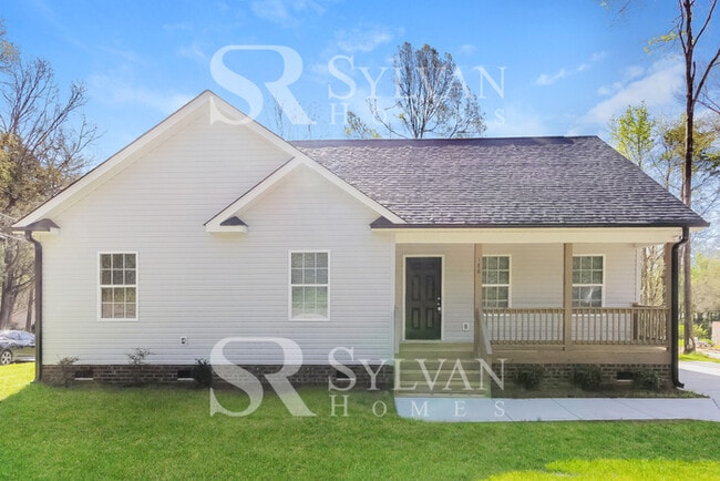 Building Photo - This charming home is ready for your personal touch!