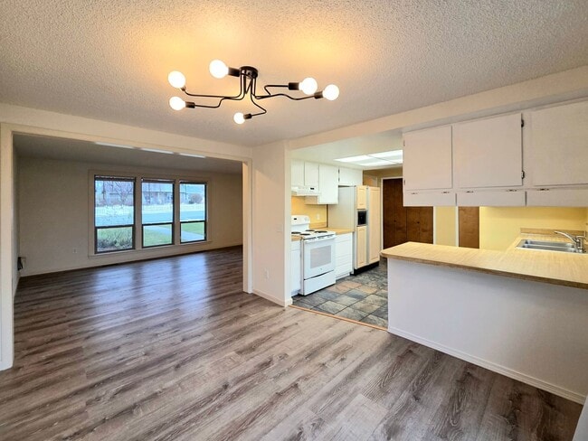 Photo - 3 Bed / 2 Bath Rambler – Huge Fenced Yard + 2-Car Garage – Available Now