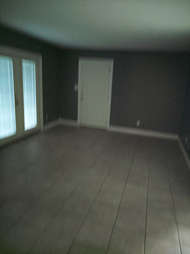 Living room French doors across pool - 2100 W Beach Dr Unit F102