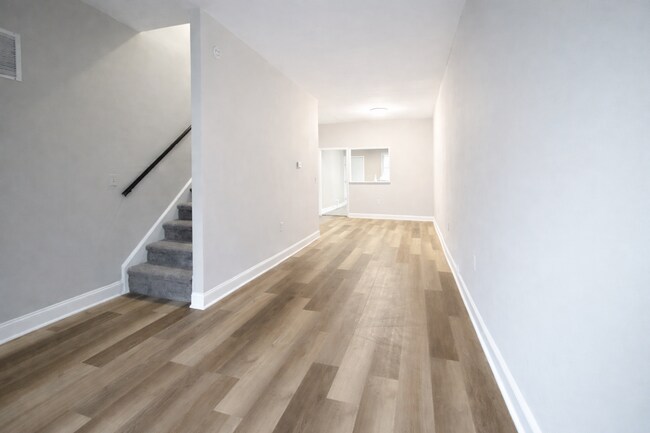 Photo - Renovated 3BR Rowhome with Central AC & Fenced Yard