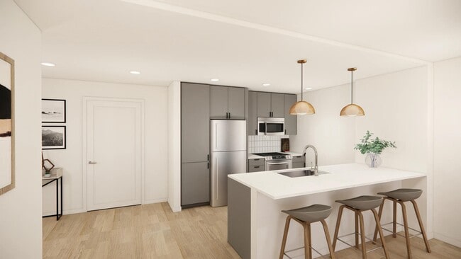 Sleek kitchens at Modera Bridle Trails feature spacious islands, designer finishes, and open layouts. - Modera Bridle Trails
