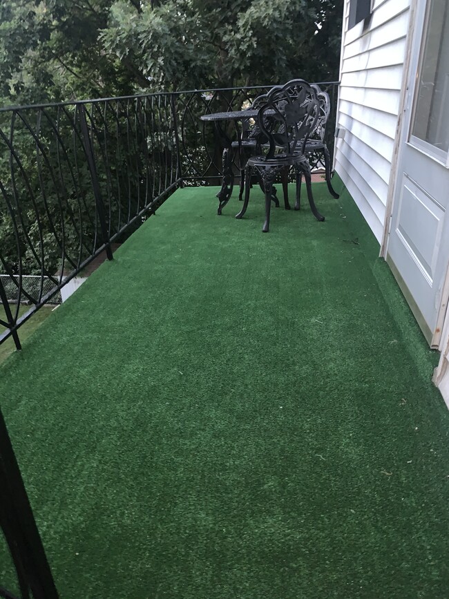 Balcony with grill, table, bench and chair! - 178 Vernon Ave