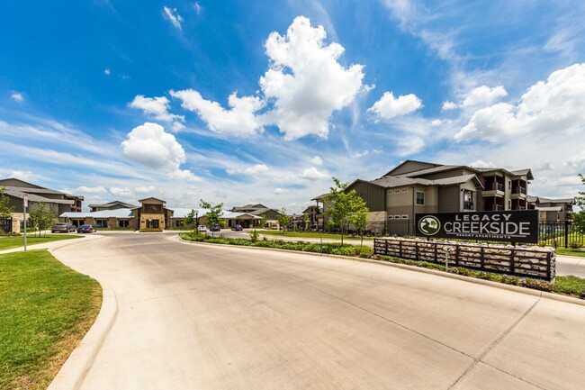 Three Bedrooms & Two Bathrooms. Spacious Floor Plan with Kitchen Island, Dining Nook, Living Room with access to a Patio with Storage Closet. 1350 Square Feet. - Legacy Creekside Apartments