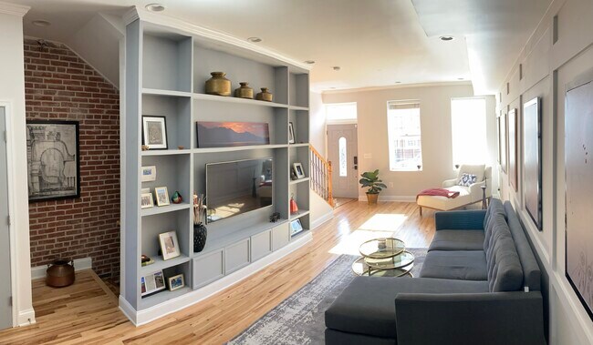 Living, entertaining area flooded with natural light - 313 Elm St NW Townhome