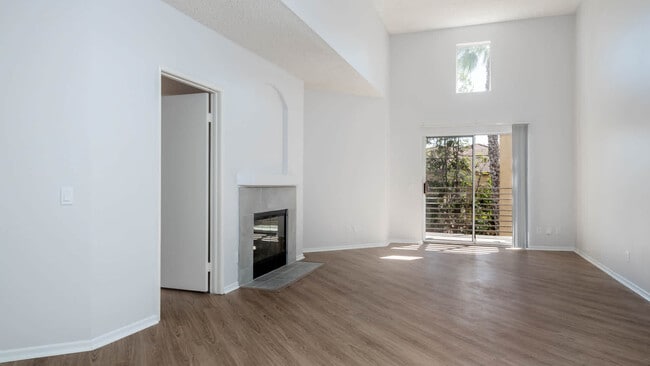 Living Room with Fireplace and Balcony