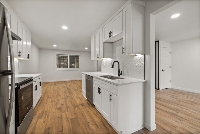 Spacious kitchen opening into living room - Rosedale Townhomes