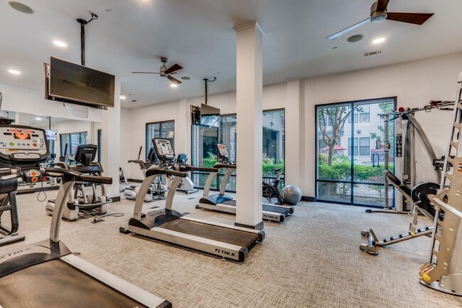 fitness center with cardio and weight equipment