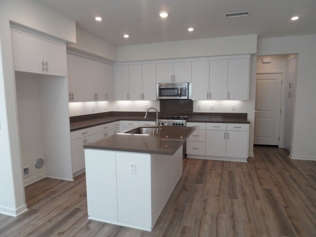 Photo - 4BR 3BA two-story condo with 2 Car Attache...
