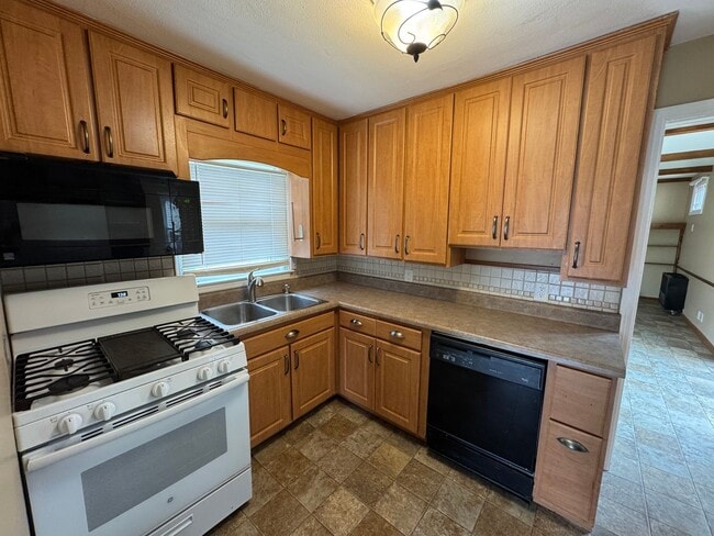 Photo - Charming 3 Bedroom Home With Fireplace and 2-Car Garage in Moline!