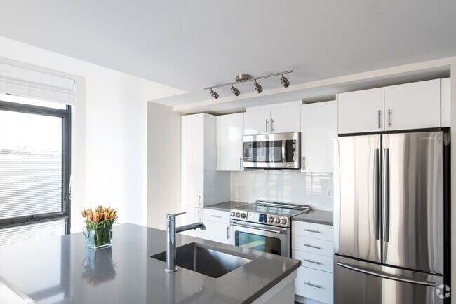 Interior Kitchen with White Cabinets and Prep Island - Berkshire 15 Rental